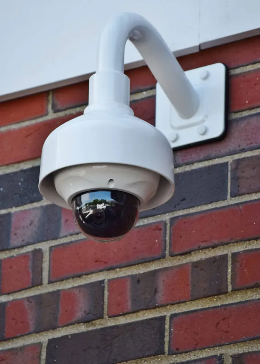 Cayer security camera installed on brick