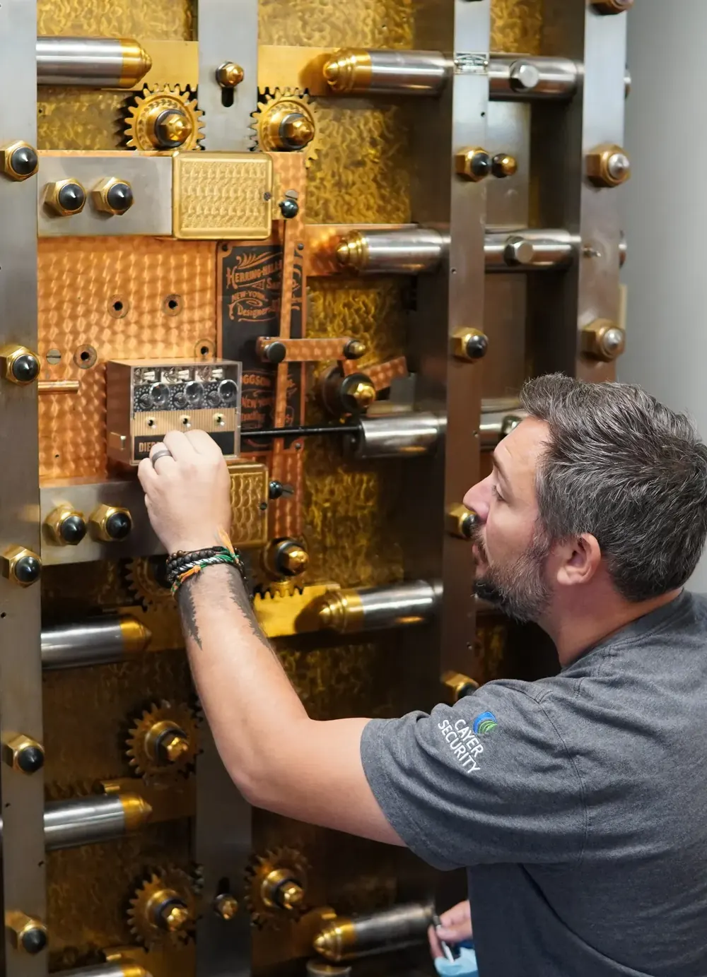 Cayer technician servicing a bank vault door
